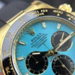 Rolex Daytona 126518LN clone saat – turkuaz kadranlı, 40mm altın kasa, THB üretimi, siyah Oysterflex kayışlı üst düzey replika model.